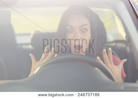 Frightened Female Going To Drive Car For First Time By Herself, Keeps Jaw Dropped, Stares At Wheel, 