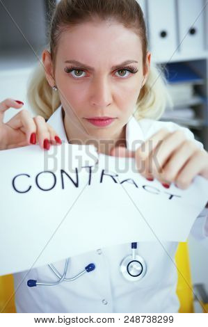 Hands Of Female Medicine Doctor Ripping Contract Closeup. Break The Rules - Failure Business Concept