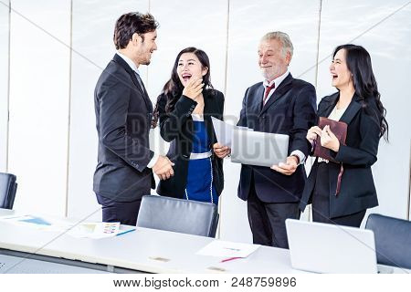group of successful businessman. Discussion of the business profits of the company in meeting roon o