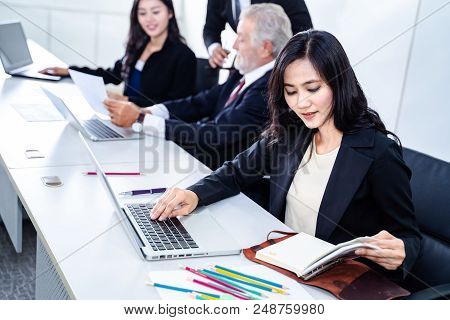 group of successful businessman. Discussion of the business profits of the company in meeting roon o