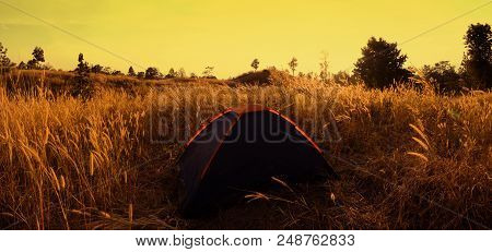 Outdoors Camping Grass Highlands Mountain In The Sunset.