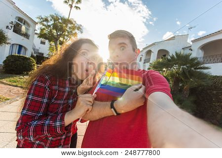 Amazing Homosexual Promote Their Relationship. Holding Gay Flag