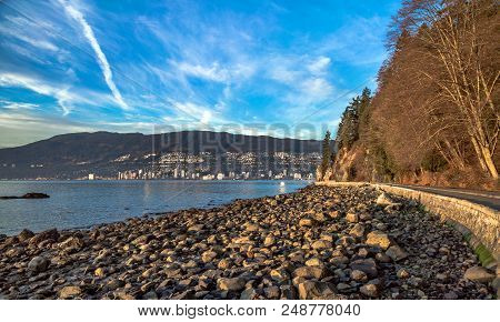 Stanley Park Vancouver, Rocky Beach, Seawall And Embankment  At The Time Of Low Tide. Autumn, Almost