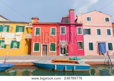 Rectilinear View Of The Colored Facades Of Buildings On The Island Of Burano, Near Venice, Italy