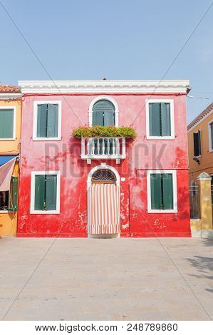 Rectilinear View Of The Colored Facades Of Buildings On The Island Of Burano, Near Venice, Italy