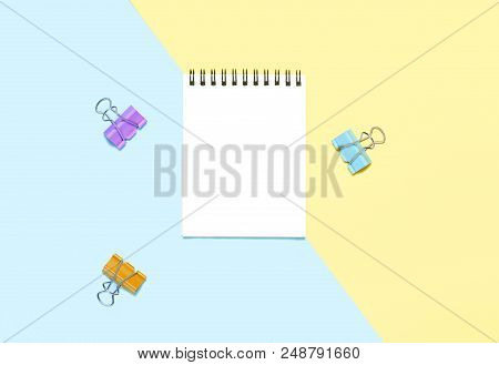 Empty Notebook Or Notepad On Yellow And Blue Background. Creative Minimalism Chancery Concept. Top V