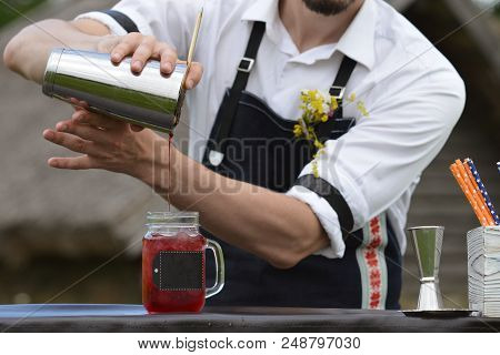 Bartender Workplace. Bartender On The Street Catering Bar Preparing A Coctail In A Mason Jar, Select