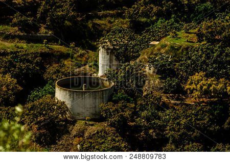 Concrete Irrigation Basin On High Hills In Andalusia, A Place Of Water Storage In Arid Areas