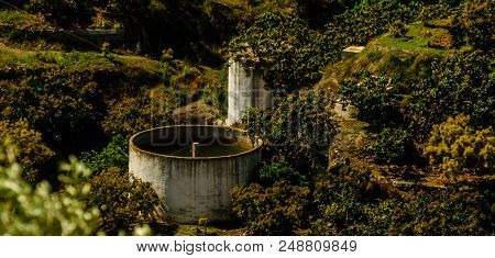 Concrete Irrigation Basin On High Hills In Andalusia, A Place Of Water Storage In Arid Areas