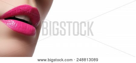 Close-up Of Woman's Lips With Bright Fashion Pink Glossy Makeup