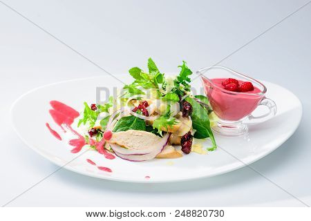 Classic Italian Food. Salad With Chicken In A Raspberry Sauce On A White Plate, Light Background