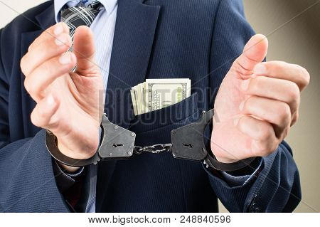 Arrested Businessman In Handcuffs. Businessman Bribetaker Or Briber. Concept Of Fraud, Detention, Cr