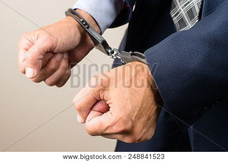Arrested Businessman In Handcuffs. Businessman Bribetaker Or Briber. Concept Of Fraud, Detention, Cr
