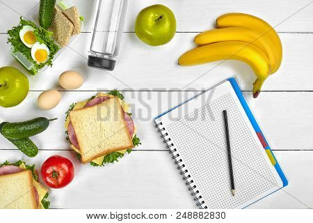 Top View Planning Notebook With Copy Space And Healthy Breakfast. Sandwich With Ham And Cheese, Eggs