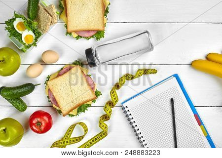 Top View Planning Notebook With Copy Space And Healthy Breakfast. Sandwich With Ham And Cheese, Eggs