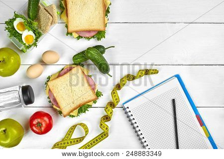 Top View Planning Notebook With Copy Space And Healthy Breakfast. Sandwich With Ham And Cheese, Eggs