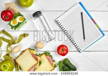 Top View Planning Notebook With Copy Space And Healthy Breakfast. Sandwich With Ham And Cheese, Eggs