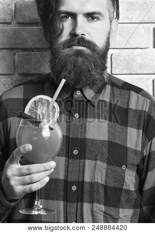 Man Holds Alcohol Cocktail On Brick Wall Background. Masculinity Drink Concept. Hipster Enjoy Strong