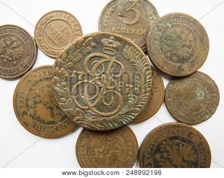Pile Of Vintage Metall (copper) Coins.coins Of The Russian Empire In The Background Kopyur.antikvari