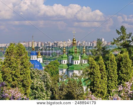 Green Domes Of Vydubytsky Monastery From The Time Of Monomakh Against The Background Of The Dnipro. 