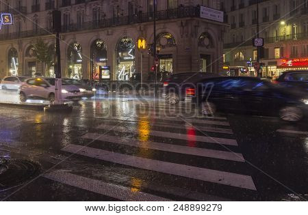 Paris, France - December 10, 2017: Heavy Rain In The City. Paris, Boulevard Haussmann, Evening, Dece