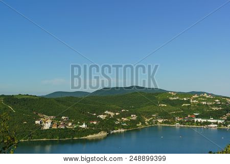 Top View Of The Slopes Of The Caucasus Mountains Around The Picturesque Lake Abrau