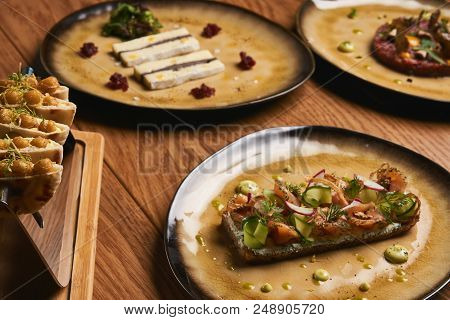 Table With Food Top View. Delicious Luxury Food Table With Slice Of Brie Cheese, Smorrebrod, Danish 