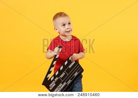 Little Cute Kid Baby Boy 3-4 Years Old In Red T-shirt Holding In Hand Classik Black Film Making Clap