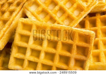 Close-up Of Homemade Fresh Brown Waffles.
View To Stacked Wafles.
Bakery And Food Backgrounds.
