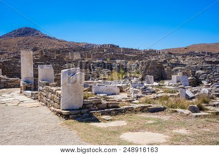 Ancient Ruins In The Island Of Delos In Cyclades, One Of The Most Important Mythological, Historical