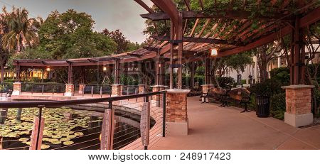 Gazebo Overlooking A Pond And Fountain At Sunset At The Garden Of Hope And Courage Memorial Garden A