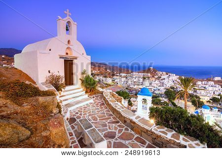 Traditional Houses, Wind Mills And Churches In Ios Island, Cyclades, Greece.