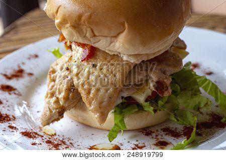 Chicken Burger With Salad On White Plate, Snack Food Closeup. Restaurant Or Eatery Menu Photo. Rich 