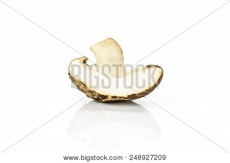 One Half Of Fresh Raw Brown Shiitake Mushroom Isolated On White