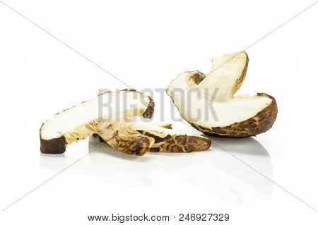Group Of One Half Two Slices Of Fresh Raw Brown Shiitake Mushroom Isolated On White