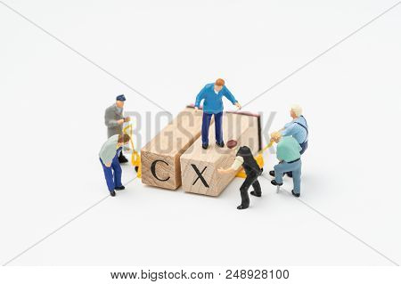 Customer Experience Concept, Miniature Workers Or Creative Team Help Building Cube Wooden Block With