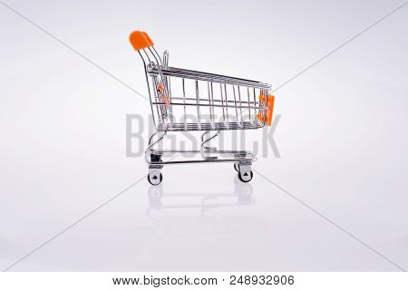 Hand Holding A Cart On A White Background