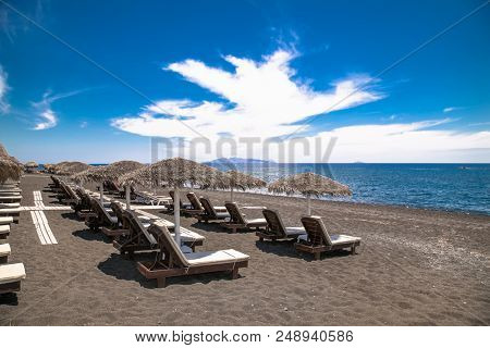 Permissa black sand beach in Santorini. Greece. 