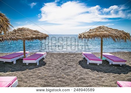 Permissa black sand beach in Santorini. Greece. 