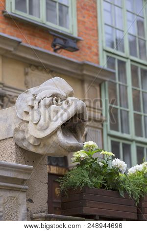 Mariacka Street, Grotesque Gargoyle On Front Of Colorful Tenement House, Main City, Gdansk, Poland