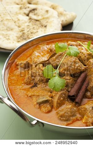 Indian Curry Lamb Rogan Josh In A Steel Karahi, With Naan Bread.