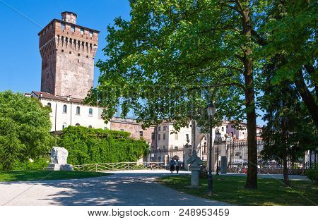 Vicenza, Italy - May 9, 2011: People In The Salvi Garden With The Scaligera Tower  In The Baclground