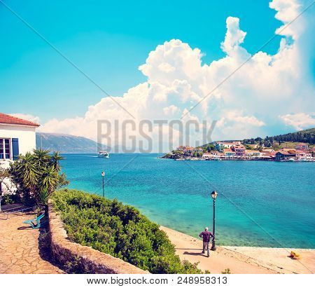Beautiful Scenic Landscape With Bay And Ferry On The Background Of Magical Clouds In Nydri, Lefkada,