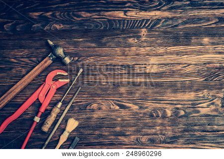 instruments for repairing on wooden background with text space