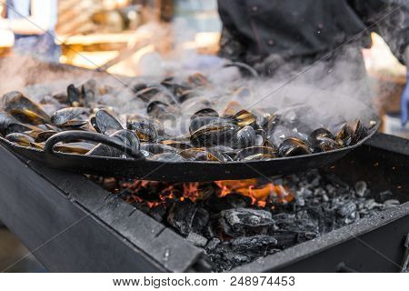 Fresh Mussels At Grill Pan. Seafood Barbecue Outdoors. Picnic Healthy Food, Mussels In Shells. Plent
