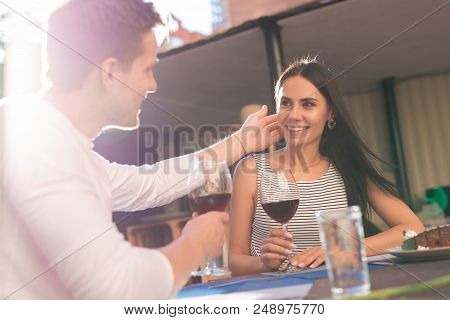 Falling In Love. Appealing Beaming Woman Falling In Love While Looking At Her Handsome Good-looking 