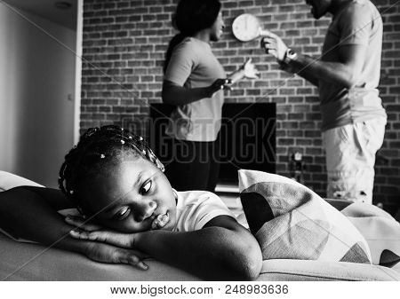 Daughter sad while her dad and mom are fighting