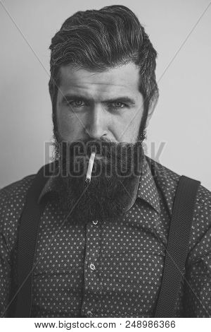 Closeup View Of One Handsome Senior Stylish Man With Black Hair And Long Lush Beard In Blue Shirt St