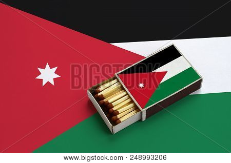 Jordan Flag  Is Shown In An Open Matchbox, Which Is Filled With Matches And Lies On A Large Flag.