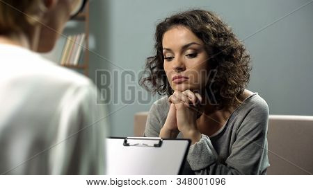 Hopeless Young Lady Listening To Psychologist Attending Personal Therapy Session